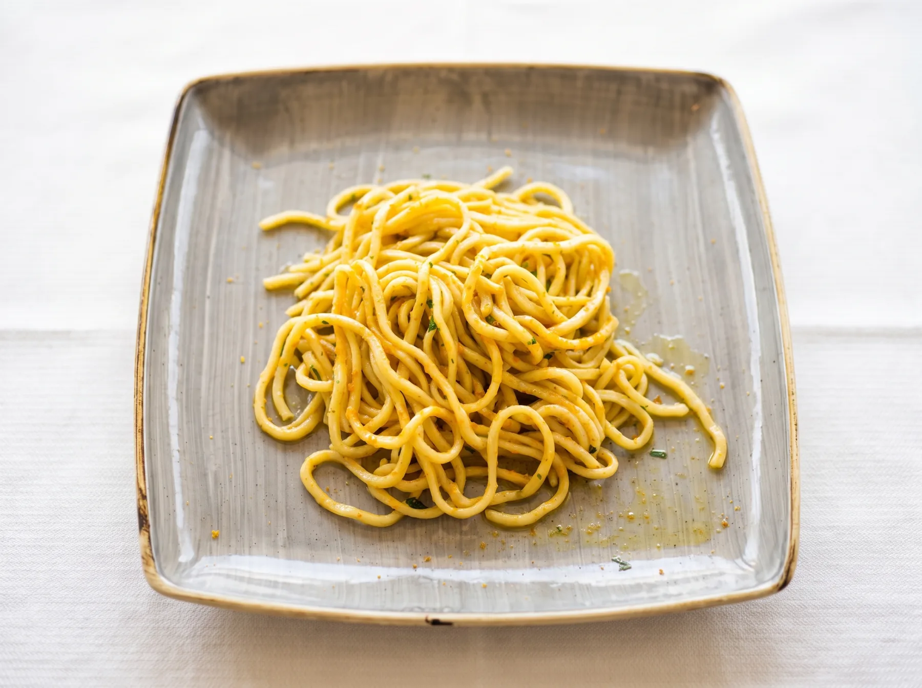 Tonnarelli mantecati con calamari e bottarga grattugiata